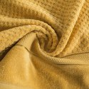 Ręcznik Jessi 70x140 musztardowy frotte 500g/m2 z fakturą wytłaczanej krateczki i welurową bordiurą Eurofirany
