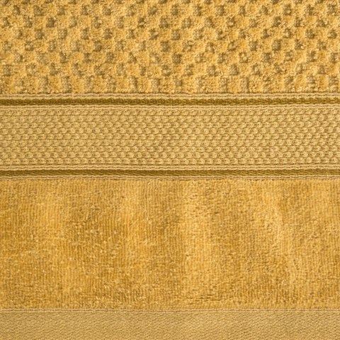 Ręcznik Jessi 30x50 musztardowy 500g/m2 z fakturą wytłaczanej krateczki i welurową bordiurą frotte Eurofirany Ręcznik Jessi 30x50 musztardowy 500g/m2 z fakturą wytłaczanej krateczki i welurową bordiurą frotte Eurofirany